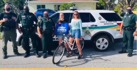 PBSO Deputies bring a replacement for Kelsey's stolen bike